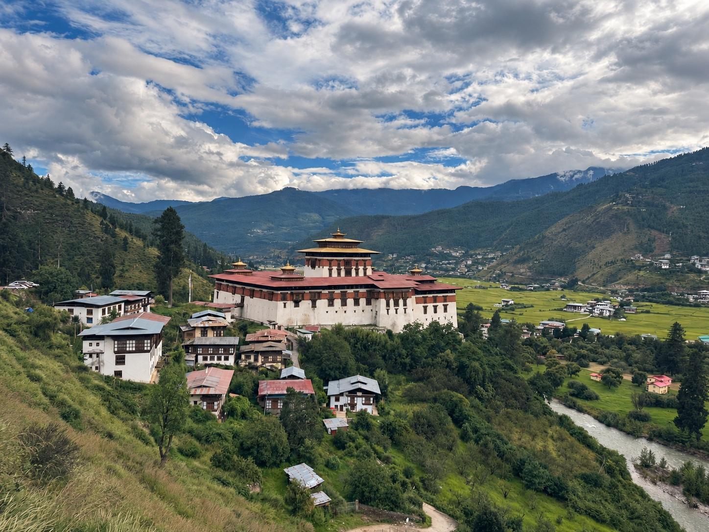 Rinpung Dzong overlooking green fields and the Paro Valley