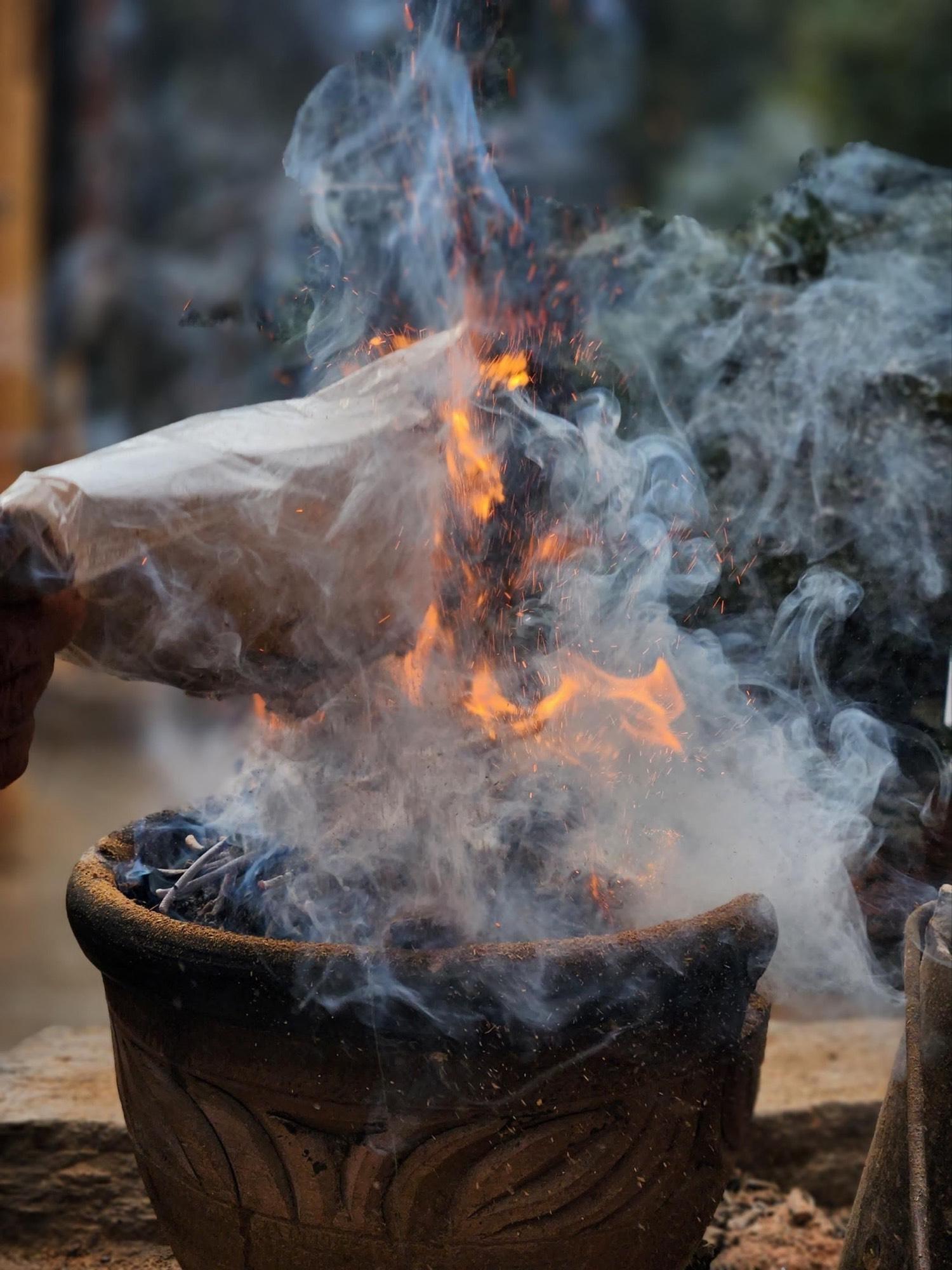Juniper incense burning in a traditional sang offering in Bhutan