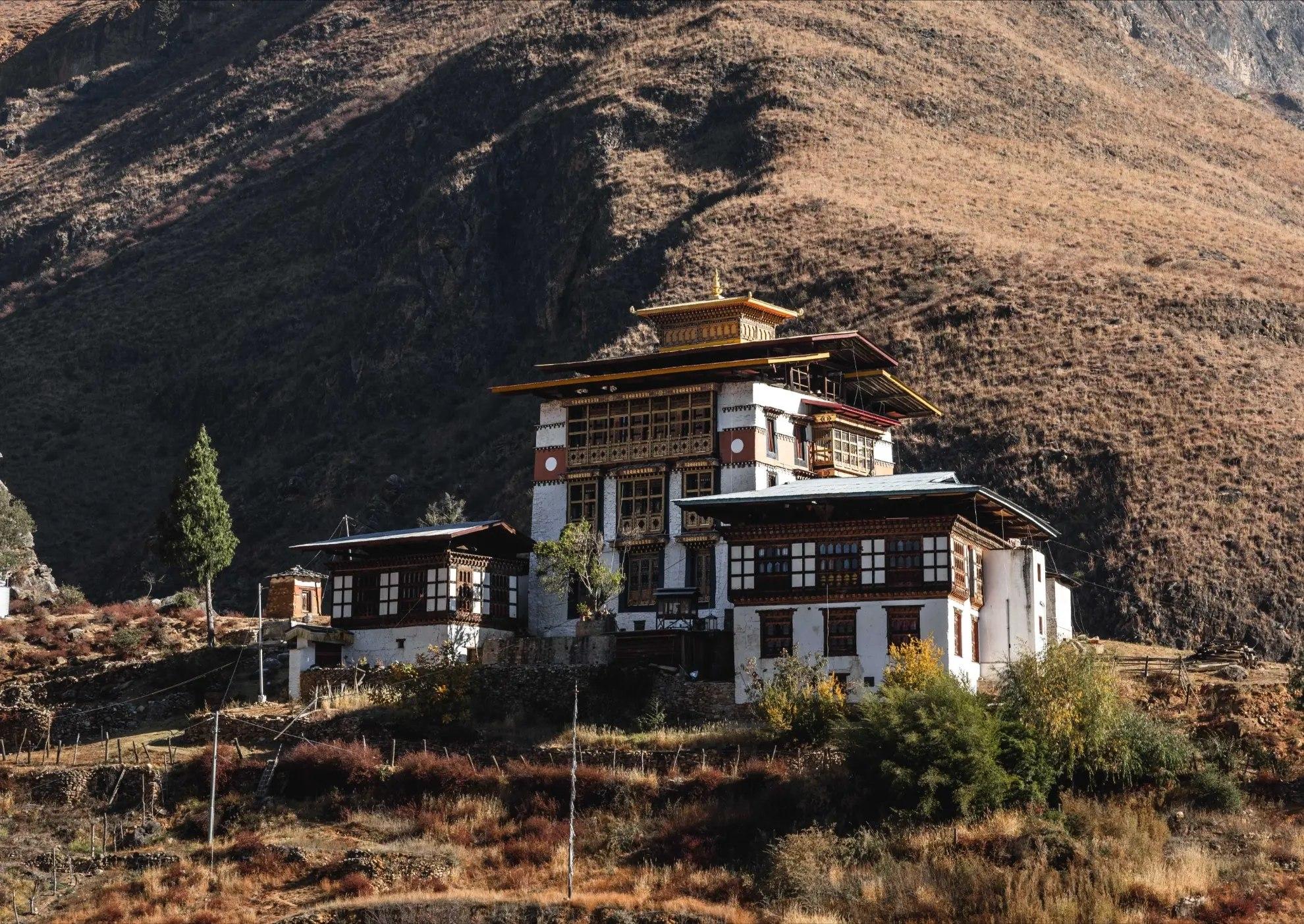 Tachogang Lhakhang set against the mountains beside the Paro–Thimphu road